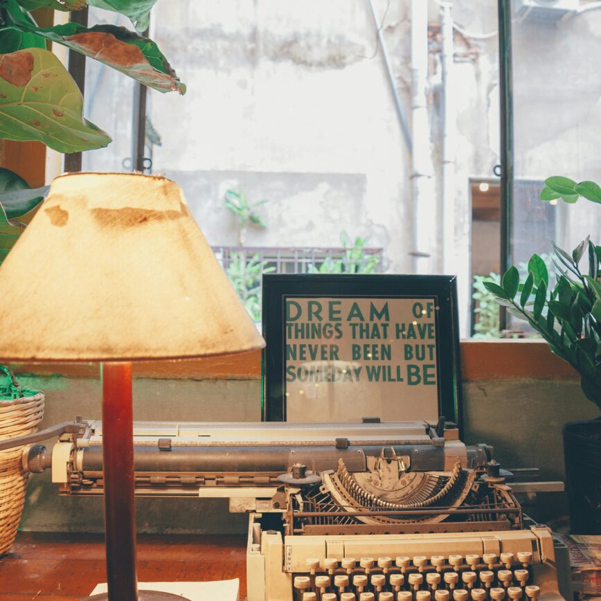 Vintage desk with lamp and typewriter